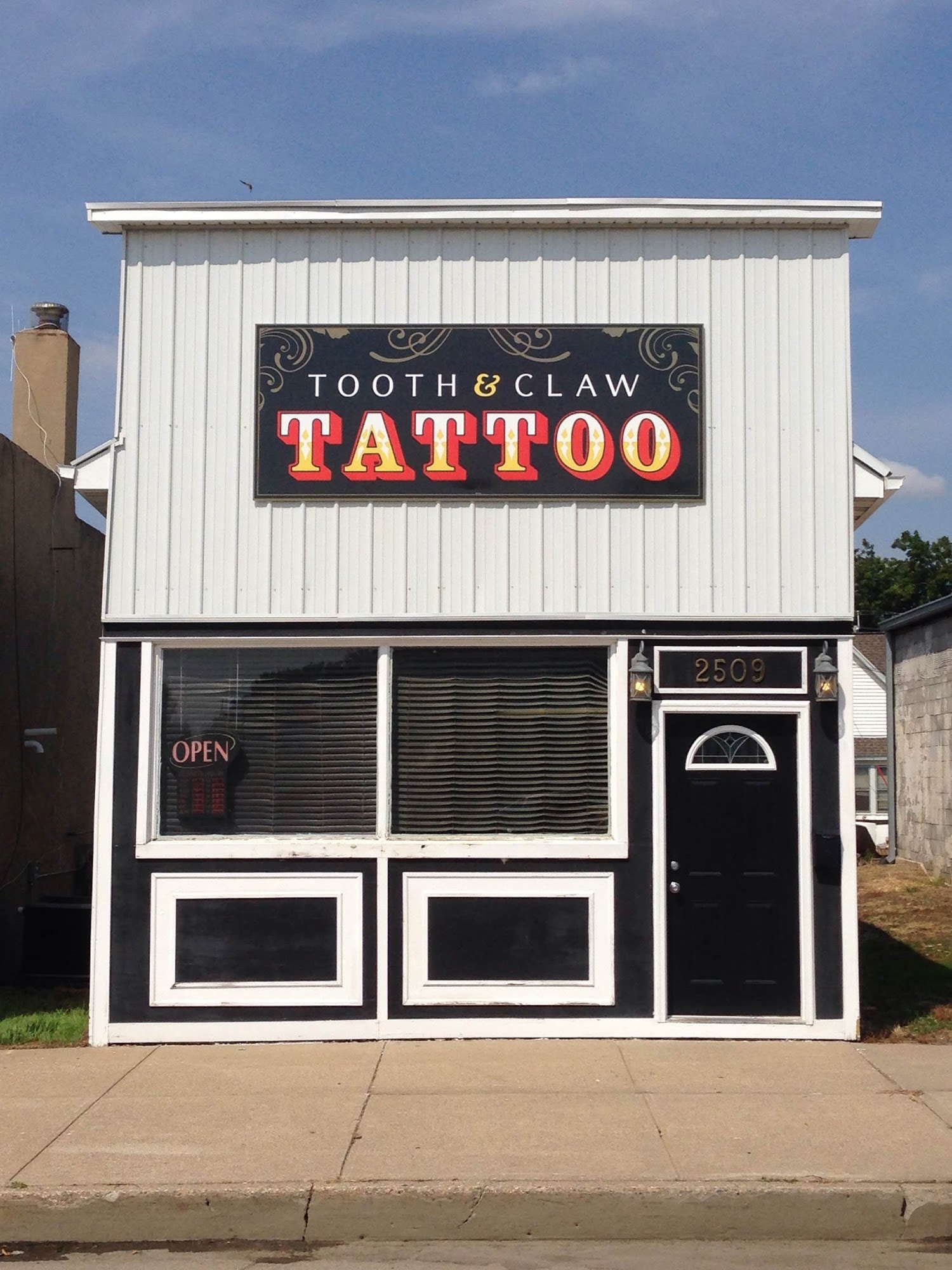 Tooth And Claw Tattoo